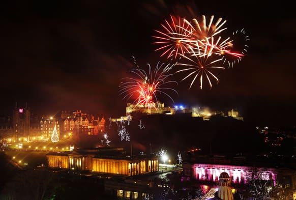 Fireworks go off over Edinburgh Castle, Scotland, as part of the New Year Hogmanay celebrations.