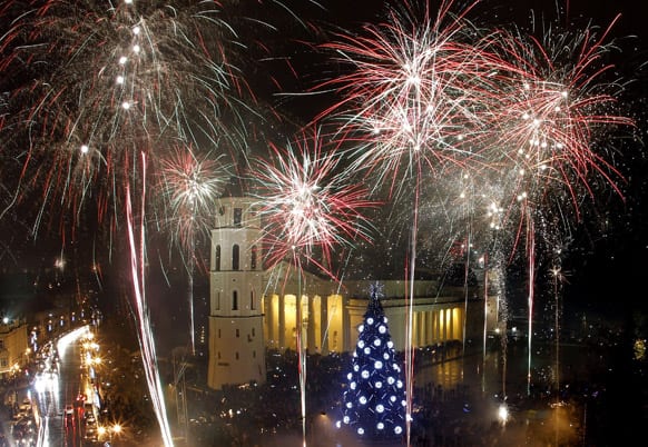 Fireworks light the sky above the Cathedral Square in Vilnius shortly after midnight, greeting the New Year.