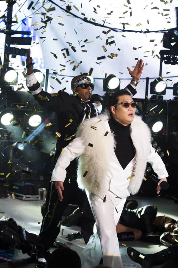 Psy and MC Hammer perform in Times Square during New Year's Eve celebrations, 2012 in New York.