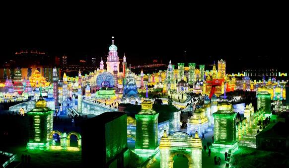 Visitors view ice sculptures during the official opening of the 29th Harbin International Ice and Snow Festival in Harbin in northeast China's Heilongjiang province.