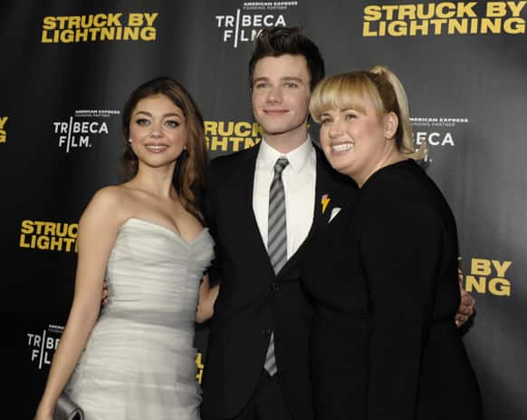 From left, actress Sarah Hyland, actor Chris Colfer and actress Rebel Wilson arrive at the premiere of the feature film
