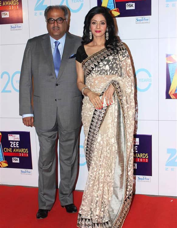 Sridevi, dressed in a Sabyasachi sari, pulls off an exquisite look, complete with the clutch. Along with her is hubby Boney Kapoor.