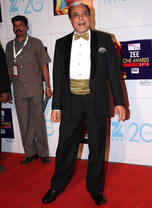 Subhash Chandra, Chaiman of Essel Group, poses for the shutterbugs on the Zee Cine Awards' red carpet.