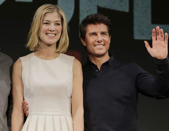 US actor Tom Cruise and British actress Rosamund Pike pose for photographers during a news conference of their film