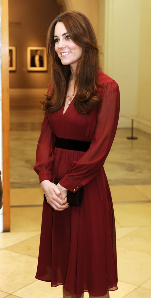 The Duchess of Cambridge smiles after viewing her newly-commissioned portrait by artist Paul Emsley at the National Portrait Gallery in central London.