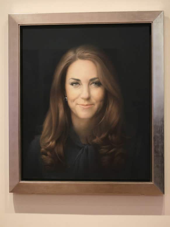 A newly-commissioned portrait of Kate, Duchess of Cambridge, by artist Paul Emsley hangs at the National Portrait Gallery in London.