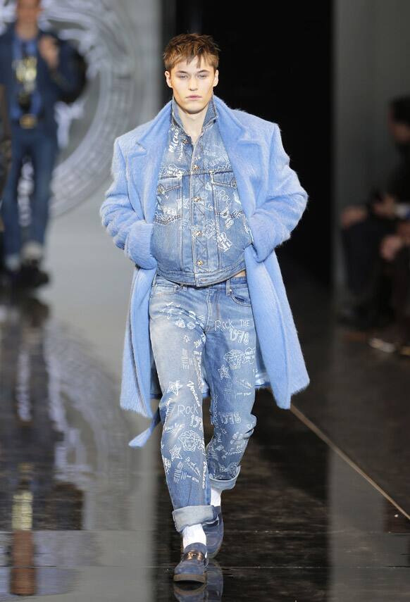 A model wears a creation of Versace men's Fall-Winter 2013-14 collection, part of the Milan Fashion Week.