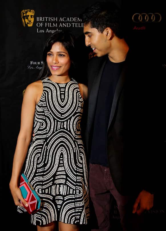Actors Dev Patel, right, and Freida Pinto arrive at the BAFTA Awards Season Tea Party at The Four Seasons Hotel in Los Angeles.