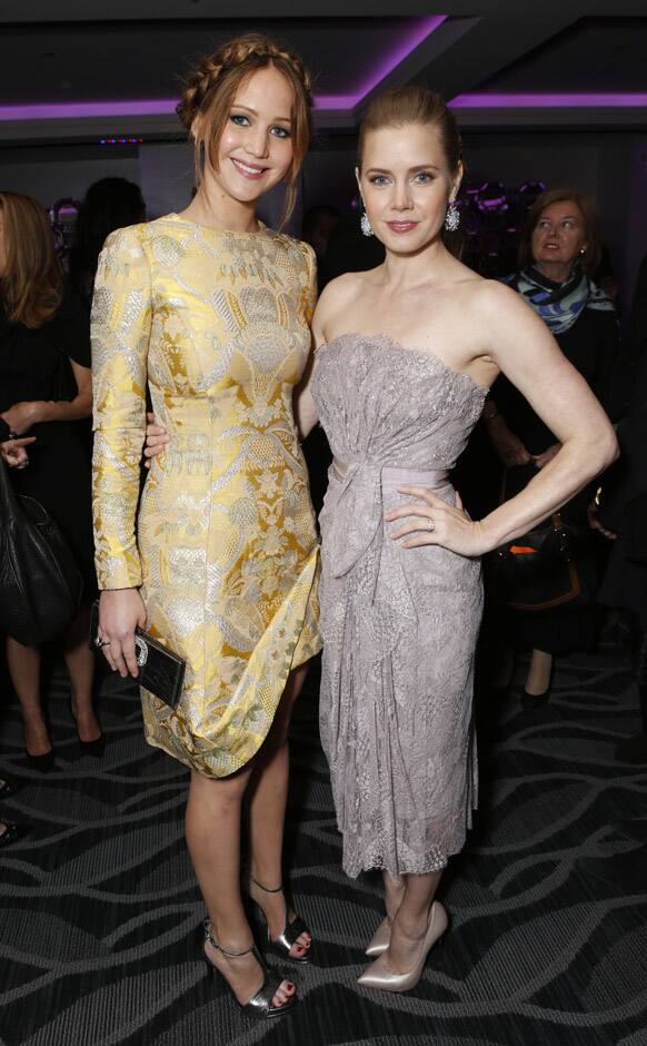 Jennifer Lawrence and Amy Adams attend the LA Film Critics Association Awards at the InterContinental Hotel, in Los Angeles.