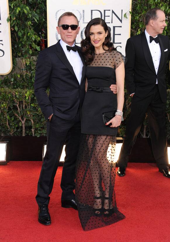 Actors Daniel Craig, left, and Rachel Weisz arrive at the 70th Annual Golden Globe Awards at the Beverly Hilton Hotel.