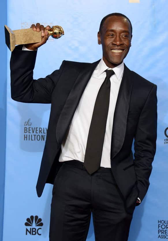 Actor Don Cheadle poses with the award for best performance by an actor in a television series - comedy or musical for