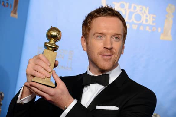 Damian Lewis poses with the award for best performance by an actor in a television series – drama for “Homeland” backstage at the 70th Annual Golden Globe Awards at the Beverly Hilton Hotel.