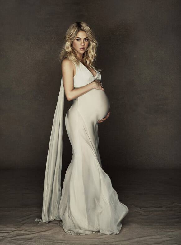 This December 2012 image released courtesy of singer and UNICEF Goodwill Ambassador Shakira shows her posing in a gown.