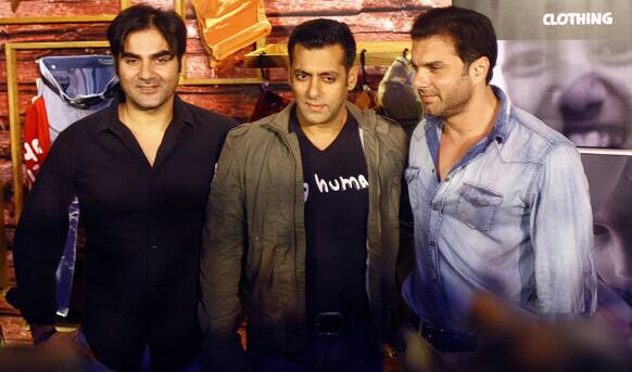 Salman Khan along with his brothers Arbaaz Khan and Sohail Khan poses for photographs during the launch of Being Human's first flagship store in Mumbai.