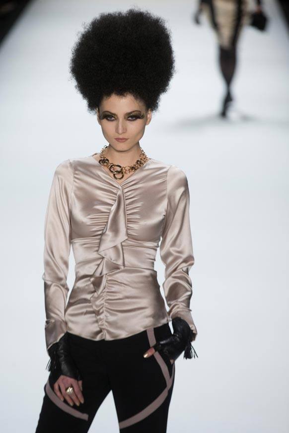 A model presents a creation by designer Guido Maria Kretschmer at the Mercedes Benz Fashion Week for autumn winter 2013 in Berlin.