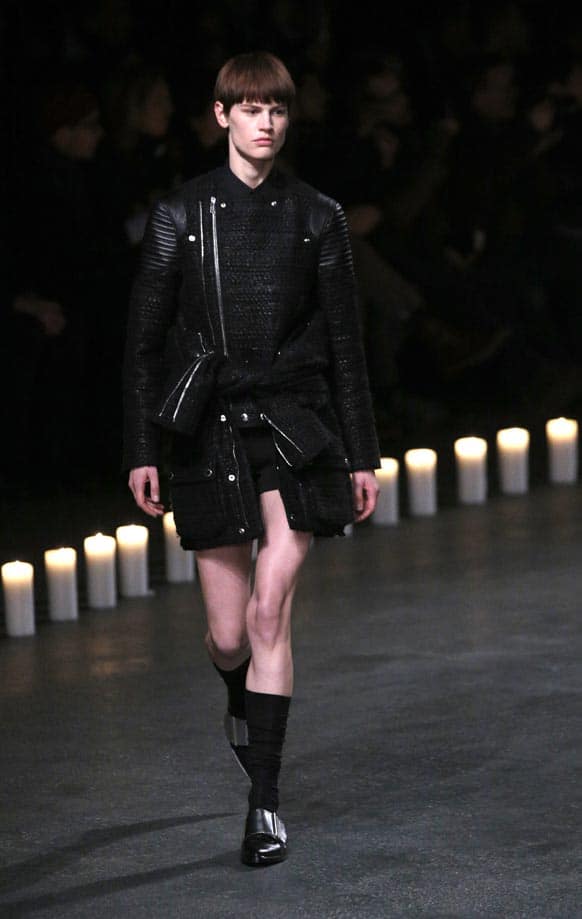 A model presents a creation by designer Riccardo Tisci for Givenchy as part of his men's fall-winter 2013/2014 fashion collection, presented in Paris.