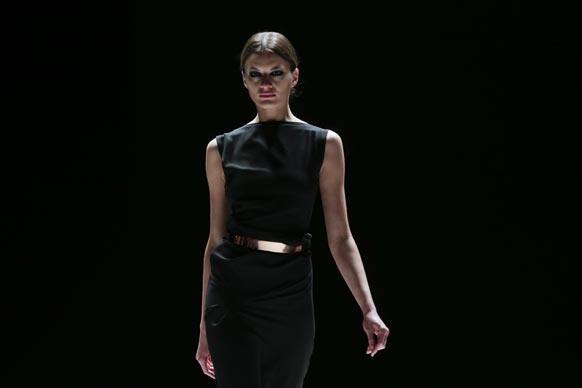 A model presents a creation of designer Dawid Tomaszewski as part of the Mercedes Benz Fashion Week for autumn winter 2013 in Berlin.