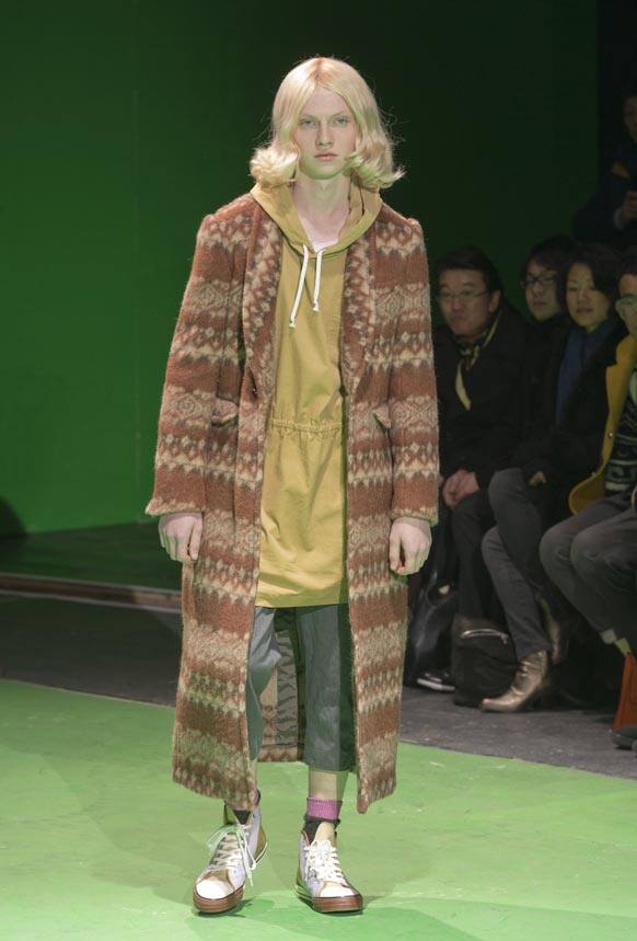 A model wears a creation by Comme des Garcons, as part of their fall-winter 2013/2014 men's fashion collection, presented in Paris.
