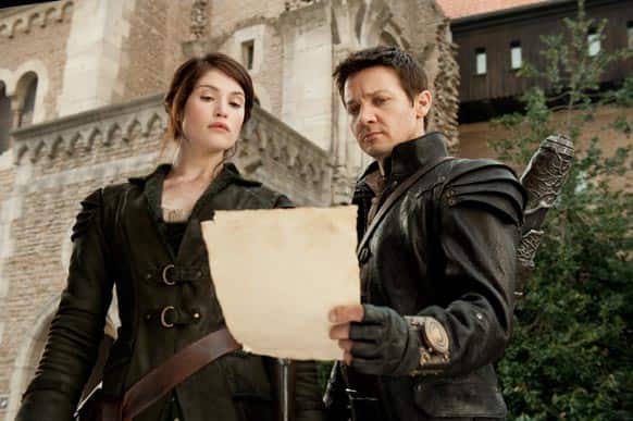 This film image released by Paramount Pictures shows Gemma Arterton as Gretel, left, and Jeremy Renner as Hansel in a scene from