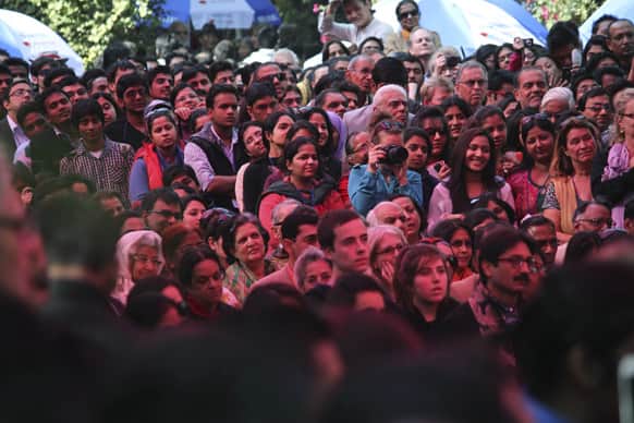 People listen to the Dalai Lama, on the opening day of India's Jaipur Literature Festival in Jaipur.