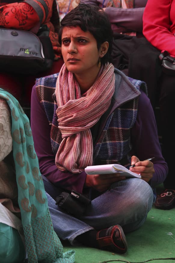 A member of the audience listens to the Dalai Lama, unseen, on the opening day of India's Jaipur Literature Festival in Jaipur.