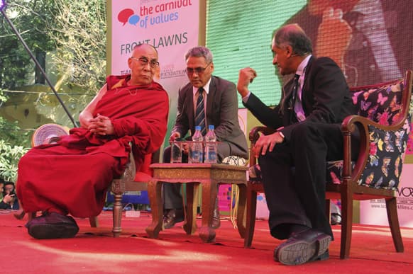 The Dalai Lama, listens to one of his biographers, Pico Iyer at one of the sessions on the opening day of India's Jaipur Literature Festival in Jaipur.