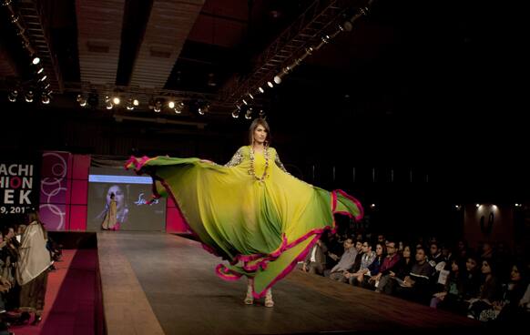 A Pakistani model presents a creation of designer duo, Faisal and Shabana, during Karachi Fashion Week.