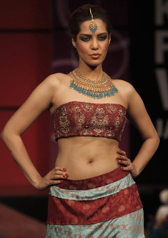 A Pakistani model presents a creation by designer Usman Dittu, on the last day of Karachi Fashion Week.