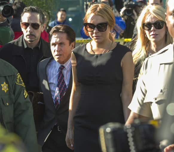 Lindsay Lohan, her mother Dina Lohan, her new attorney Mark Heller, leave a Los Angeles court, in a case filed over the actress' car crash last June.