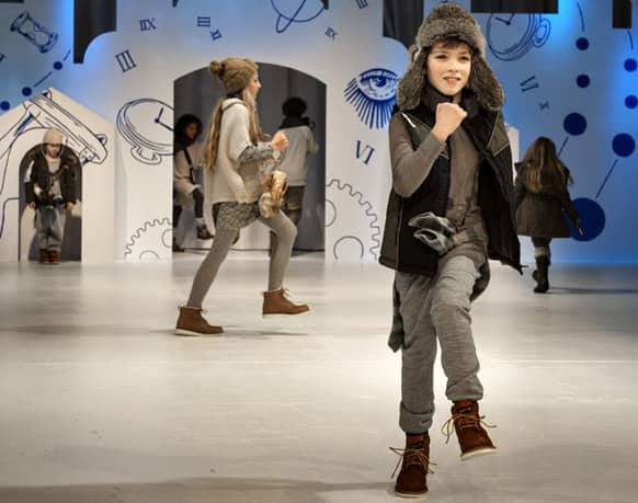 Child models wears creations from Danish designers 'CIFF Kids', for the Fall-Winther 2013 fashion collection at the Bella Center in Copenhagen, Denmark.