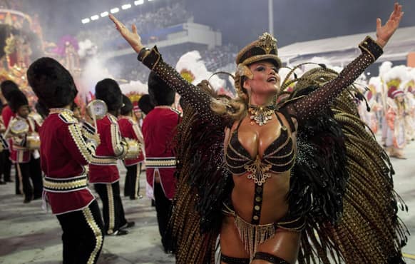 A dancer from the Rosas de Ouro samba school performs during a carnival parade in Sao Paulo, Brazil.