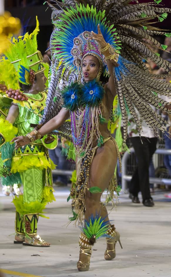 A dancer from the Vai-Vai samba school performs during a carnival parade in Sao Paulo, Brazil.