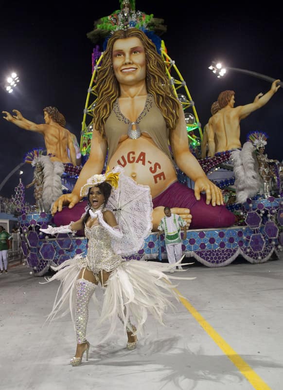 A dancer from the Mancha Verde samba school performs during a carnival parade in Sao Paulo, Brazil.