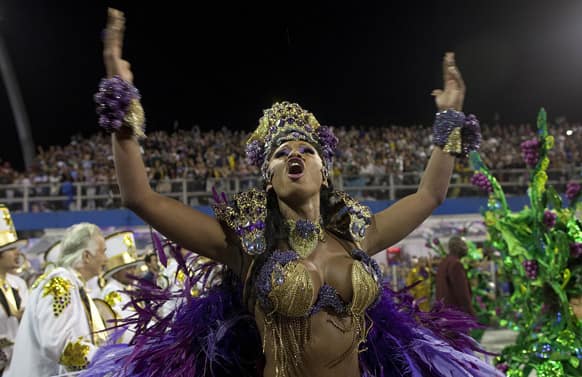 A dancer from the Vai-Vai samba school performs during a carnival parade in Sao Paulo, Brazil.