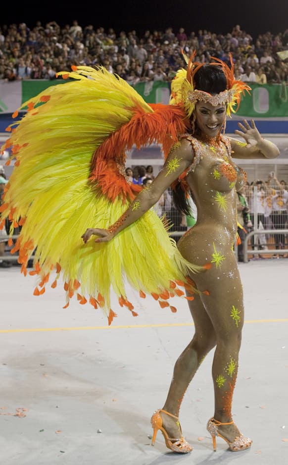 A dancer from the Mancha Verde samba school performs during a carnival parade in Sao Paulo, Brazil.