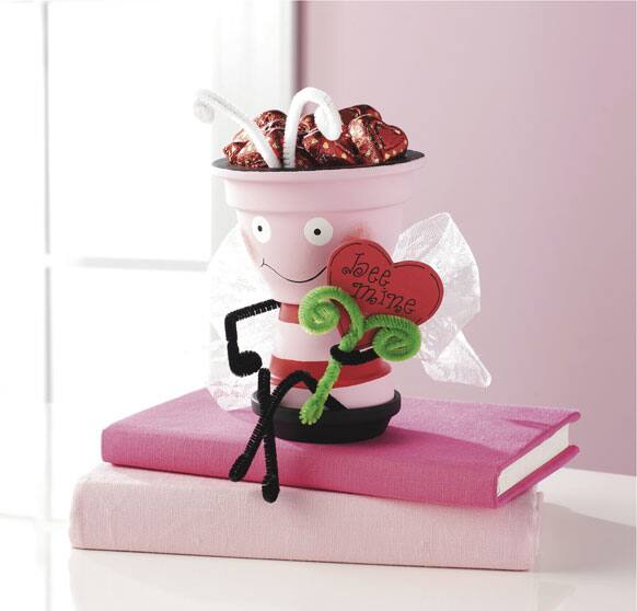 This photo shows a Clay Pot Valentine Love Bee gift pack. Popular homemade gifts include candles and bath salts, personalized photo frames, artsy fashion scarves, and candy containers that say you're extra sweet.