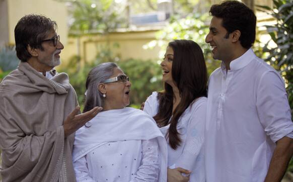 Bollywood star Amitabh Bachchan along with his wife Jaya Bachchan, daughter-in-law Aishwarya Rai-Bachchan and son Abhishek Bachchan have light moments as they pose for photographers during a charity event in aid of education for underprivileged children in Mumbai.