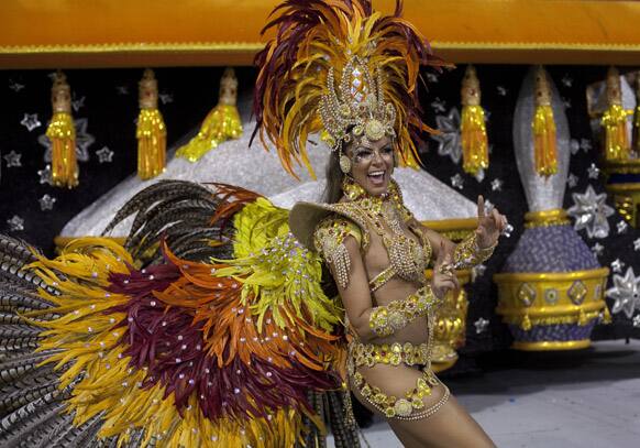 A dancer from the Gavioes da Fiel samba school performs during a carnival parade in Sao Paulo, Brazil.
