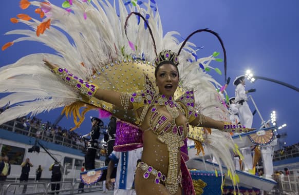 A dancer from the Imperio de Casa Verde samba school performs during a carnival parade in Sao Paulo, Brazil.