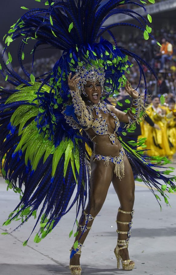 A dancer from the Unidos de Vila Maria samba school performs during a carnival parade in Sao Paulo, Brazil