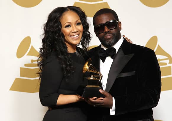 Erica Campbell, left, and Warryn Campbell pose backstage with the best gospel song award for