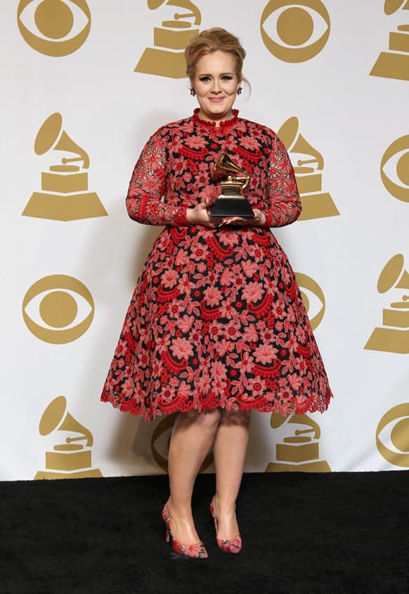 Adele poses backstage with the award for best pop solo performance for