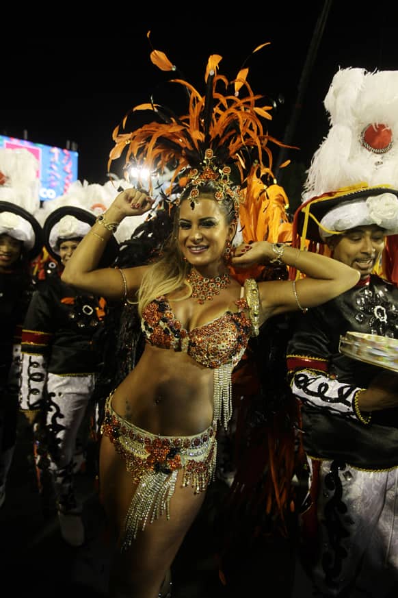 Drum queen Lucilene Caetano, from Inocentes de Belford Roxo samba school, dances during carnival parade at the Sambadrome in Rio de Janeiro, Brazil.