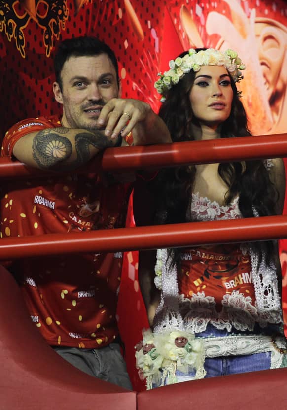 US actress Megan Fox, right, and her husband Brian Austin Green attend the carnival parades at the Sambadrome in Rio de Janeiro, Brazil.