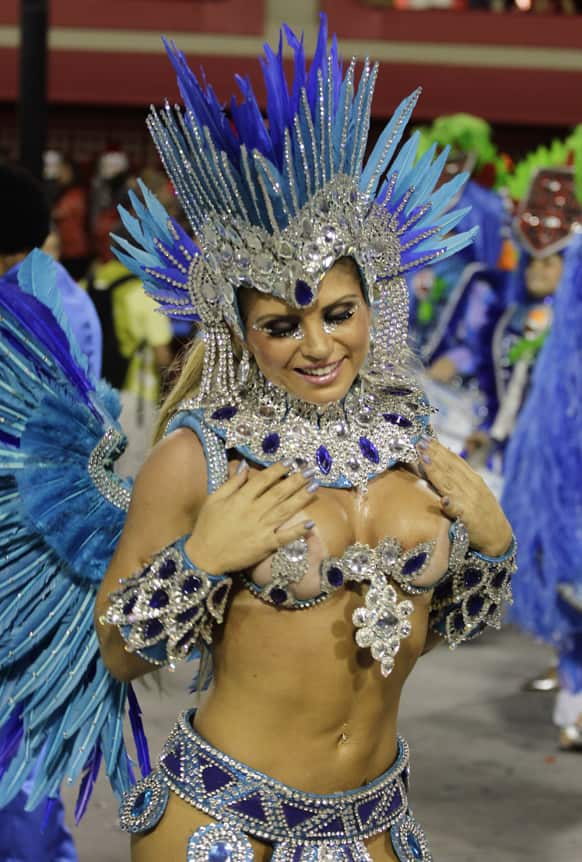 Performers from the Portela samba school parade during carnival celebrations at the Sambadrome in Rio de Janeiro.