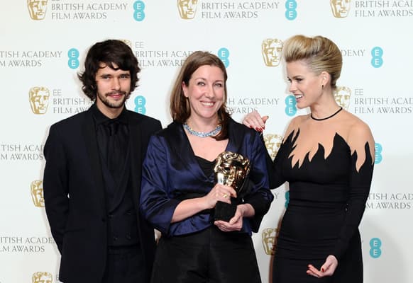 British actor Ben Whishaw, left, costume designer Jacqueline Durran, accepting the award for Make Up and Hair on behalf of Lisa Westcott, center, and actress Alice Eve pose backstage at the BAFTA Film Awards at the Royal Opera House.
