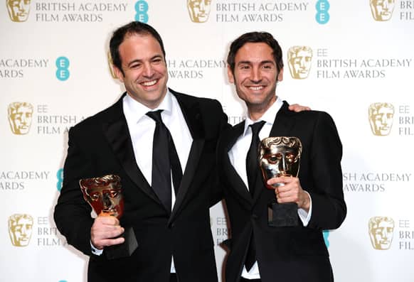 Producer Simon Chinn, left, and Swedish director Malik Bendjelloul pose with the award for Best Documentary for