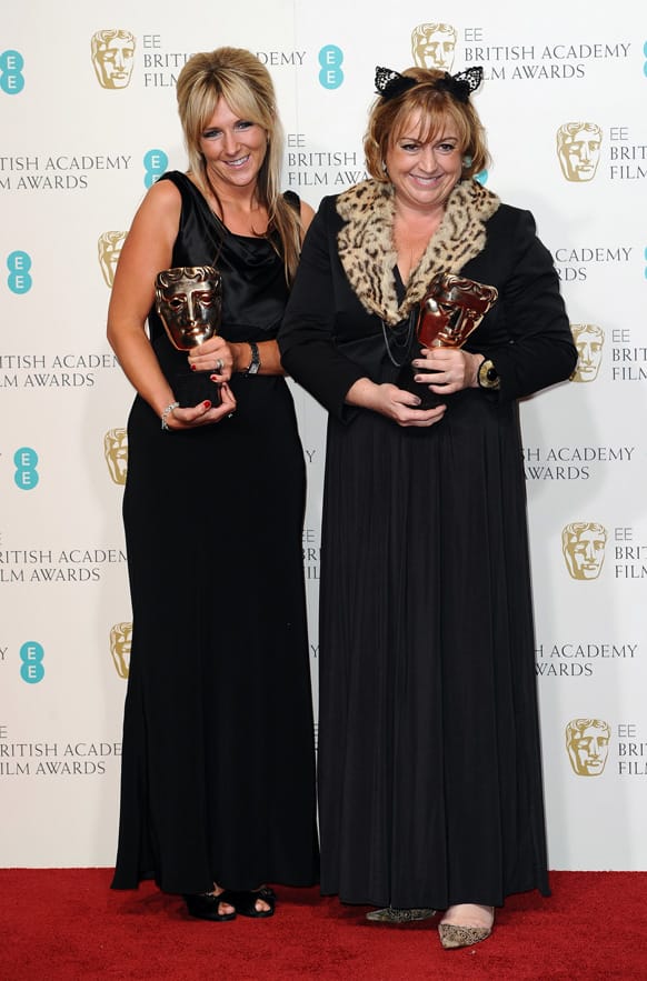Anna Lynch-Robinson, left, and Eve Stewart pose with the Production Design award for backstage at the BAFTA Film Awards at the Royal Opera House.