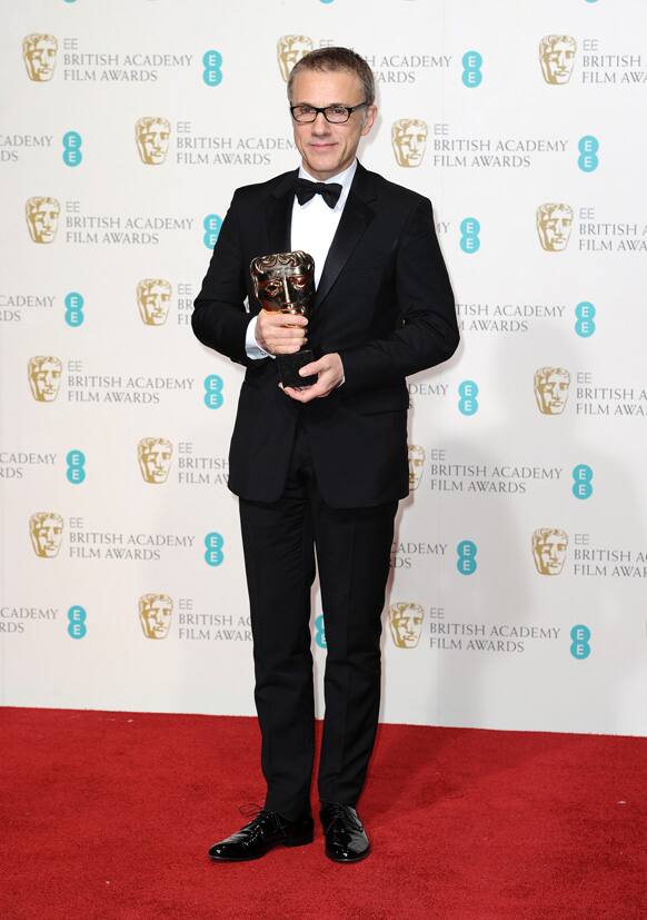Austrian-German actor Christoph Waltz poses with the award for best supporting actor for