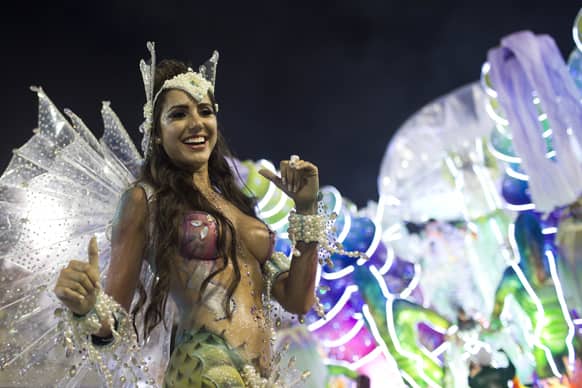 A performer from the Academicos do Grande Rio samba school parades during carnival celebrations at the Sambadrome in Rio de Janeiro.